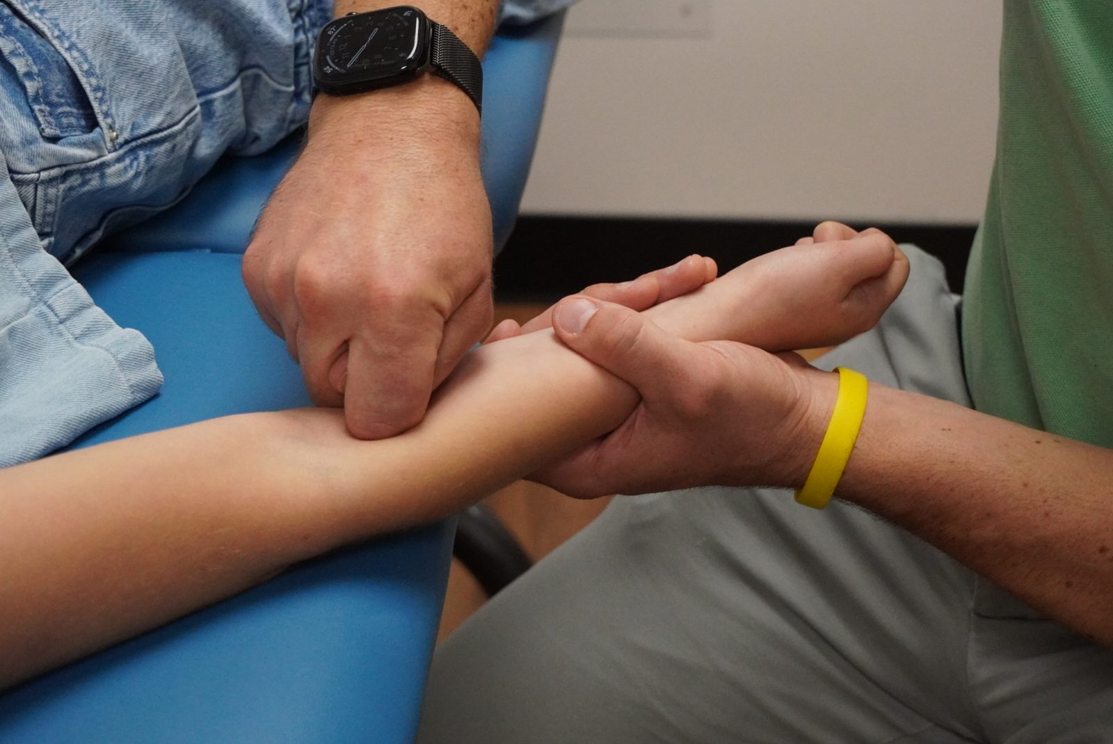 Fascial manipulation treatment being performed on a patient's forearm at Valley PT